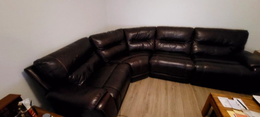 Leather sectional with recliner.