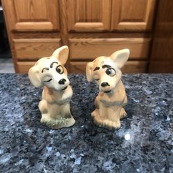 Vintage Winking Dog Salt and Pepper Shakers . Size approximately 3 1/4 inches tall.  Preowned good Condition 