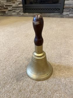 Vintage brass hand bell with a solid wood handle 