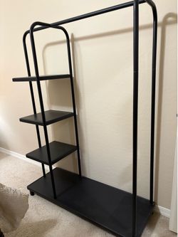 Clothes rack with shelves
