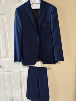 New men’s young men’s Calvin Klein navy suit -drycleaned, but never worn