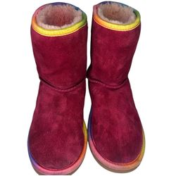 UGG Boots  Carefully chosen soft, cozy toddler UGG boots in a rich pink suede with playful multicolor trim.  Size Toddler 3 