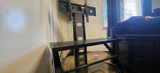 Adjustable t v stand with 3 shelves.