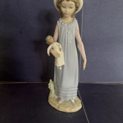 Lladro - Girl Holding Doll