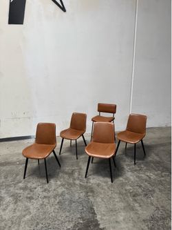 Brown leather dinning table chairs