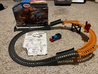 🚂 The Thomas & Friends 2014 Track Master Motorized Railway Breakaway Bridge Set is a colorful and interactive toy