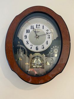 Small World Rhythm DWS Timecracker (Model 4MH752), a "Magic Motion" wall clock that features an animated display and hourly melodies.