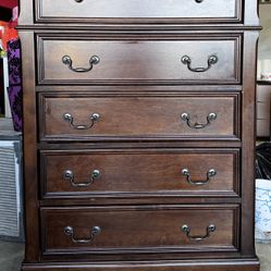 Beautifulw solid wood 5-drawer dresser with a rich dark finish and classic detailing. This piece has a high-end, elegant look without the high price t