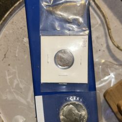 A 1903 Indian one cent penny with an authentic arrowhead a uncirculated silver 