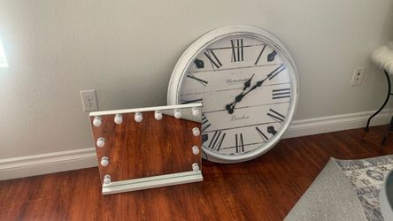 Mirror with a white wall clock