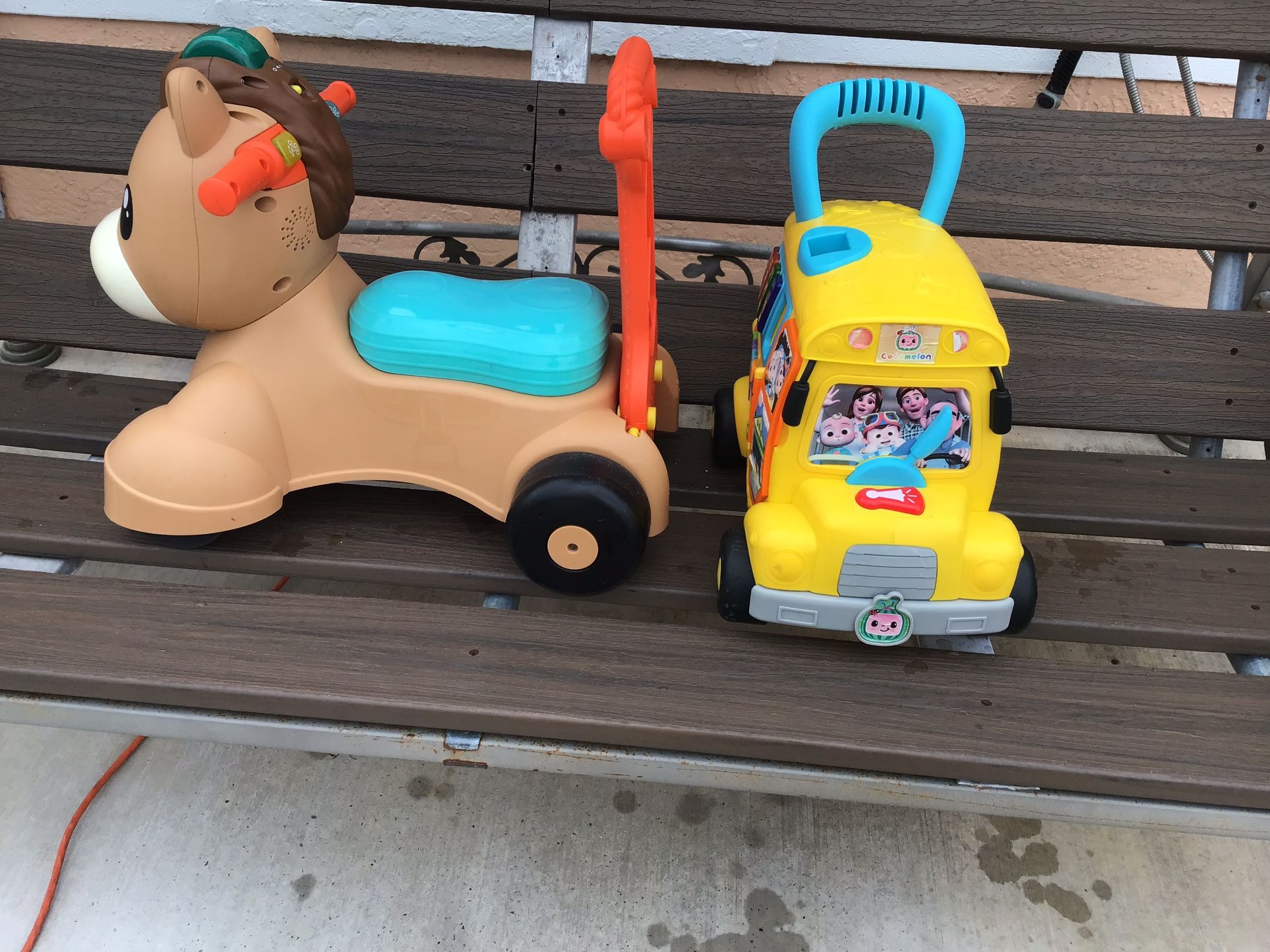 Two push toys for toddlers and a rocking horse to ride