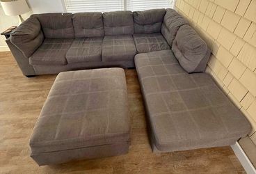 Grey sectional couch with ottoman