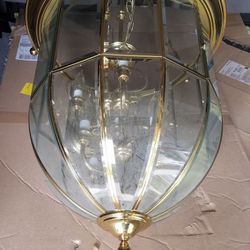 Hanging brass and beveled glass chandelier with eight bulb fixtures 