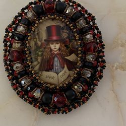 Handmade brooch by an artist in Italy. Comes in a mesh gift bag.