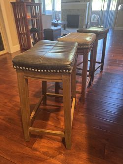Set of 3 leather topped studded bar stools