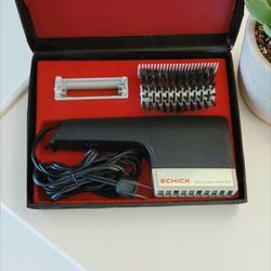 Vintage Schick Styling Dryer, model 336, complete with its original case and accessories.