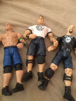 3 wrestling figurines