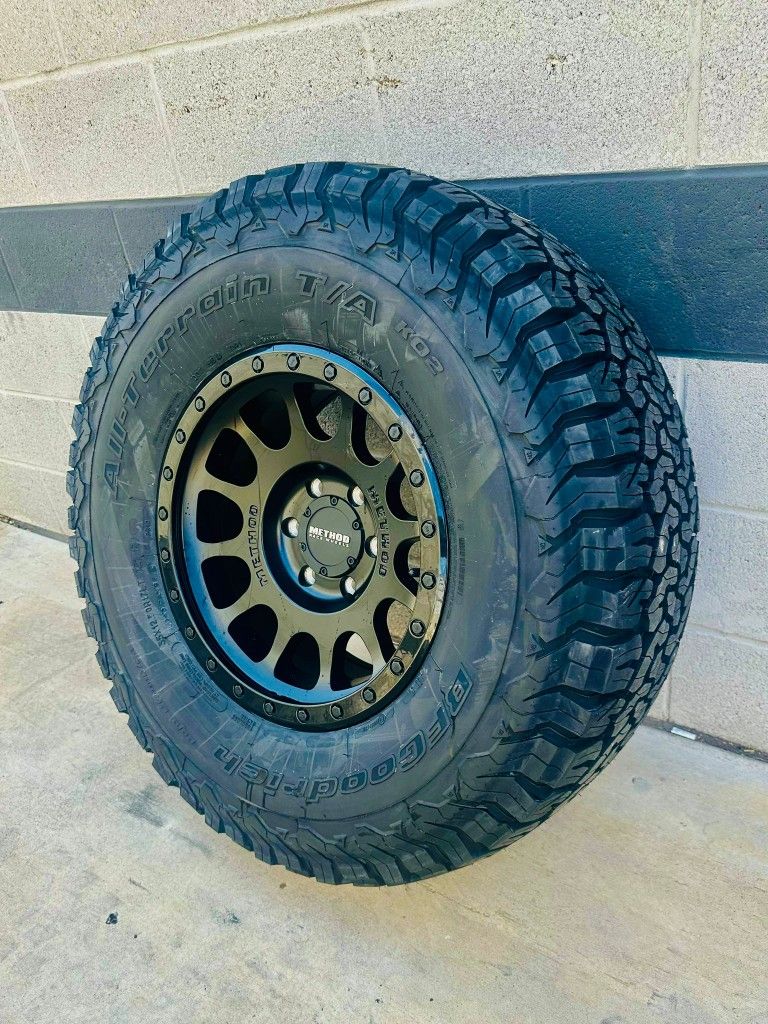 New Method 17x8.5 Black On Black Wheels & 35x12.50-17 BF Goodrich Ko2 A/T Tires For Truck & Suv 5 6 8 LUG (We Finance