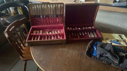 2 wooden chest ,Holmes Edwards silver plated flatware , cloth