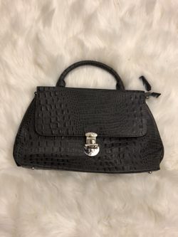 Cleo & Patek handbag