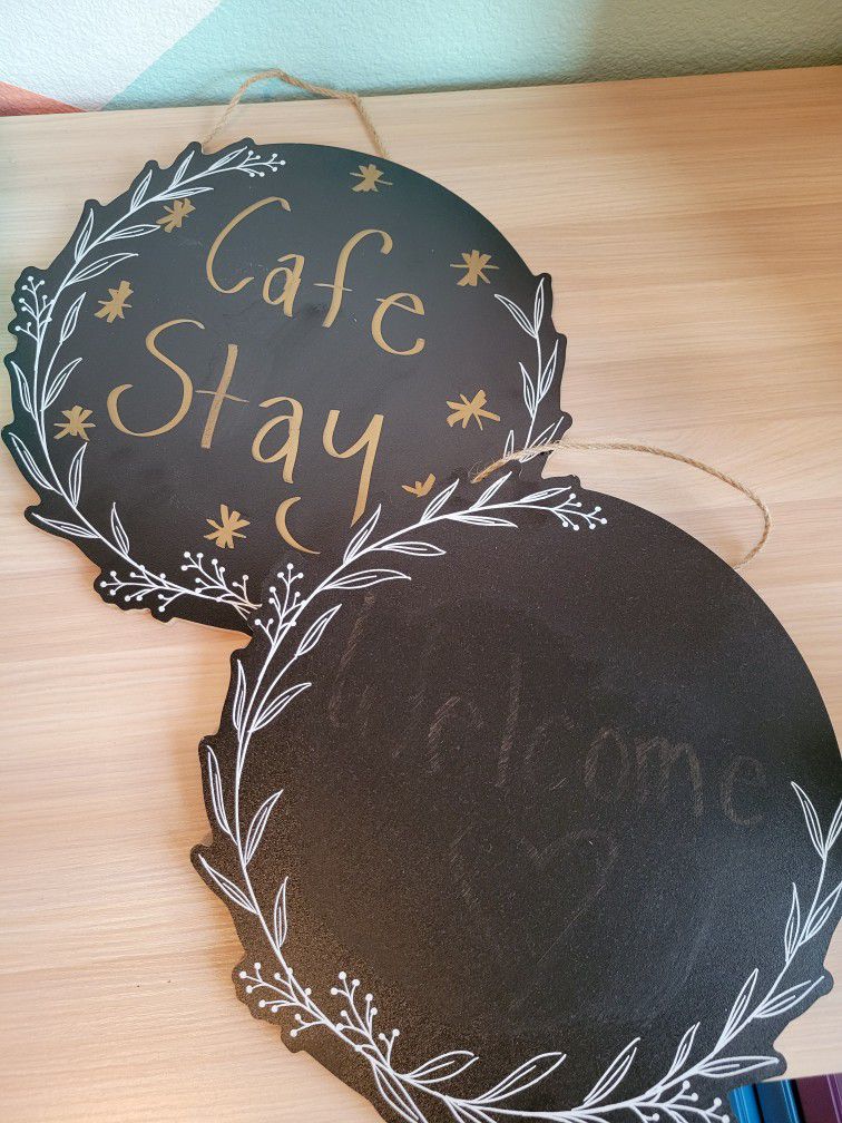 Two Round, Black Chalkboard Signs