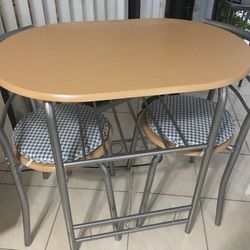 Table With Two Chairs And Cushions