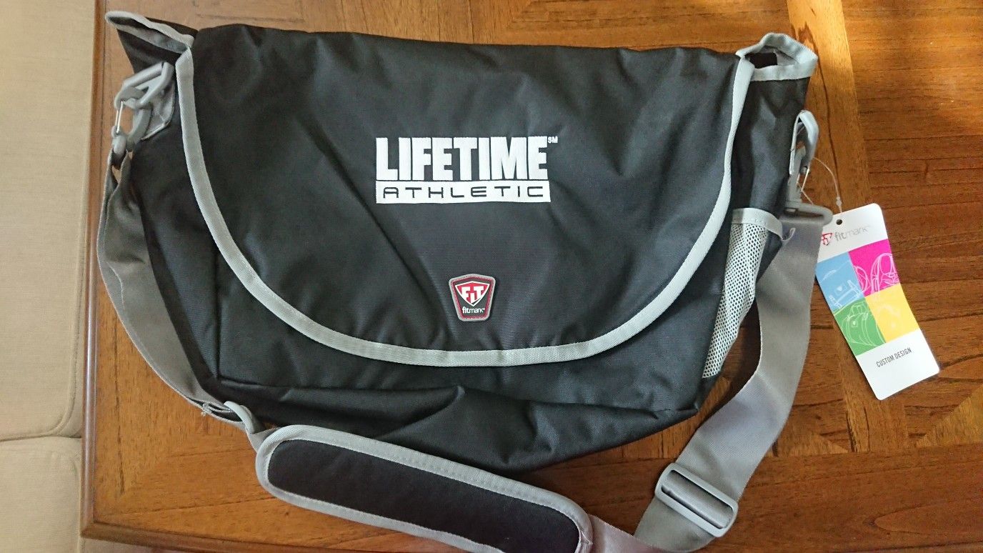 Fitmark Lifetime Athletic bag. Brand New, removable and adjustable strap;  more of pockets inside.  Water bottle pocket on outside side, Black Color. 