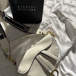 Cream leather purse. With dust bag and body strap