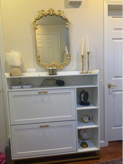White storage unit with built-in LED lighting.