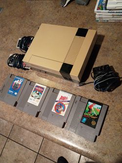 Nintendo NES system with four games take it off for 60 bucks pick up in Glendale