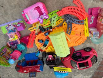 Assorted toys, chichi train and train tracks and wheels