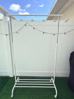 Selling a white clothing rack, 69 x 39 x 20 inches.