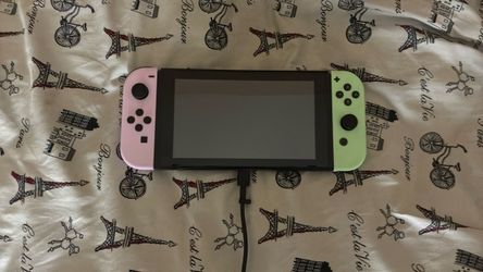 Nintendo Switch with Pink and Green Joy-Cons