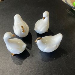  a vintage collection of white porcelain ducks or geese featuring gold-accented beaks.  Set 4 Pc