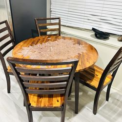 Counter height dining table with four chairs with fold out for extra space