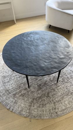 Crate and Barrel round black iron coffee table $150
