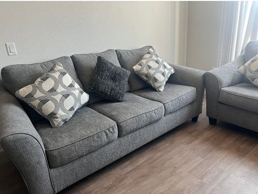 Selling 2 Brand New Gray Couches