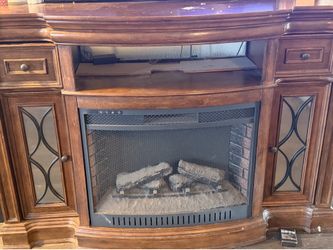Solid old fireplace TV unit