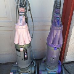2 working Dyson vacuum cleaners. 