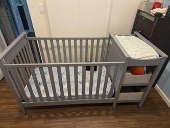 Crib with changing table and storage