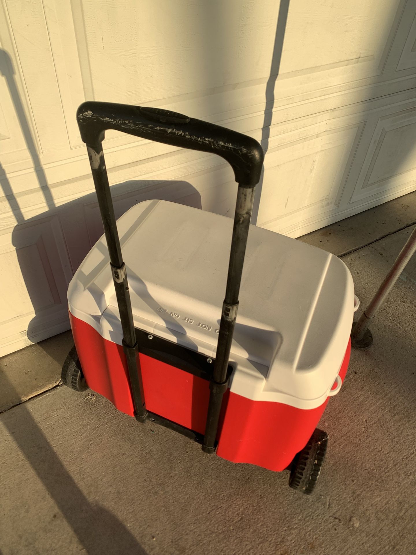 Red Igloo Coler With Wheel And Drain Plug