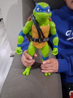 12 inches  Ninja turtle action figure.  Good condition.