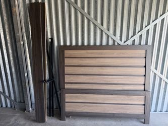 Brown wood queen standard bed