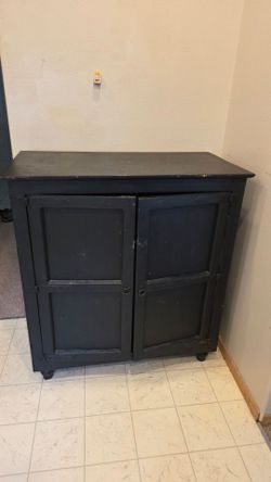 Black wooden storage cabinet