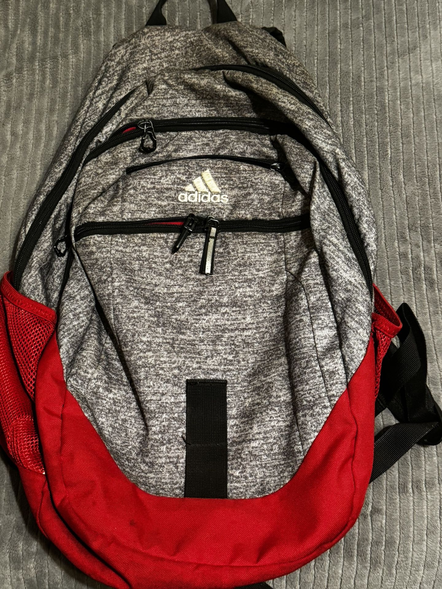 Adidas red and grey backpack