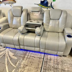 Like new leather electric dual reclining couch with electric headrests and dual usb and led lighting