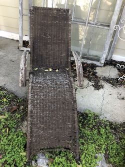 Two vintage wicker lounge chairs