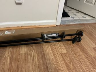 BRAND NEW CURTAIN ROD SET. 46 x 84. BLACK WITH COPPER TRIM. ONLY $15