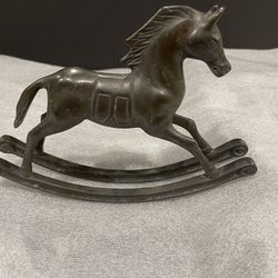 Bronze metal rocking horse. 8” wide. 