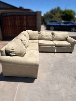 Large beige sectional sofa with pull-out sleeper bed